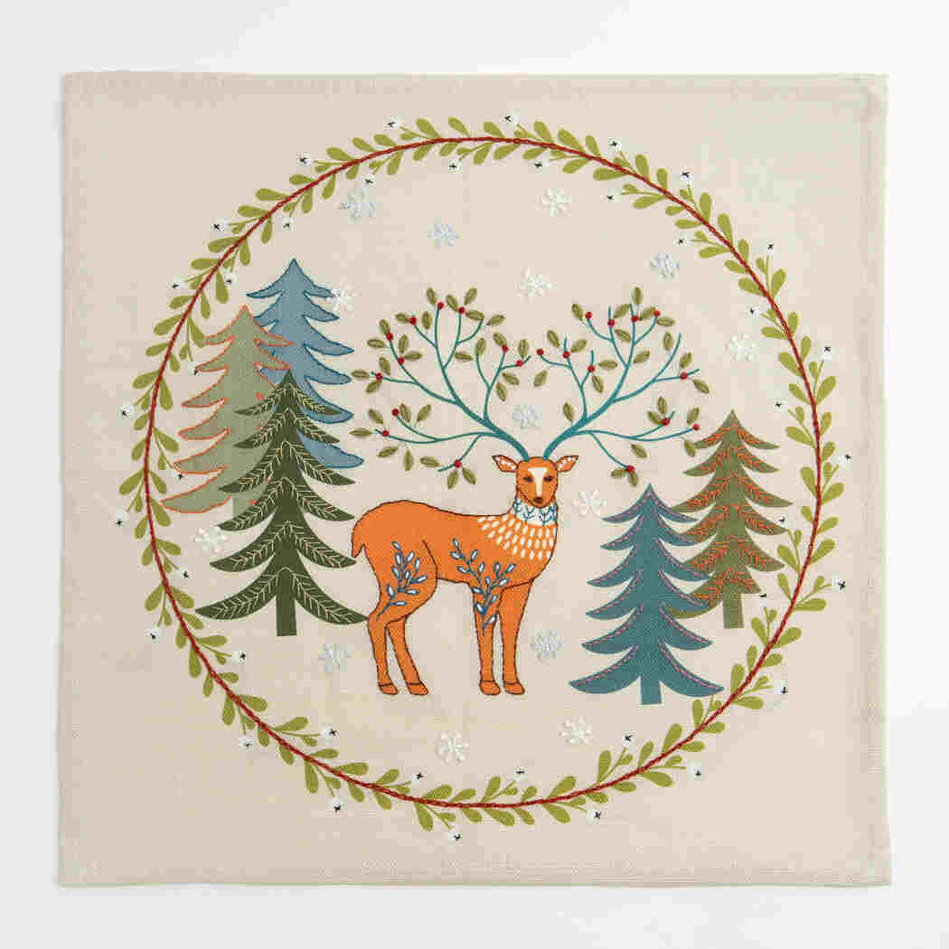 Decorative panel with a deer and trees design on a beige background