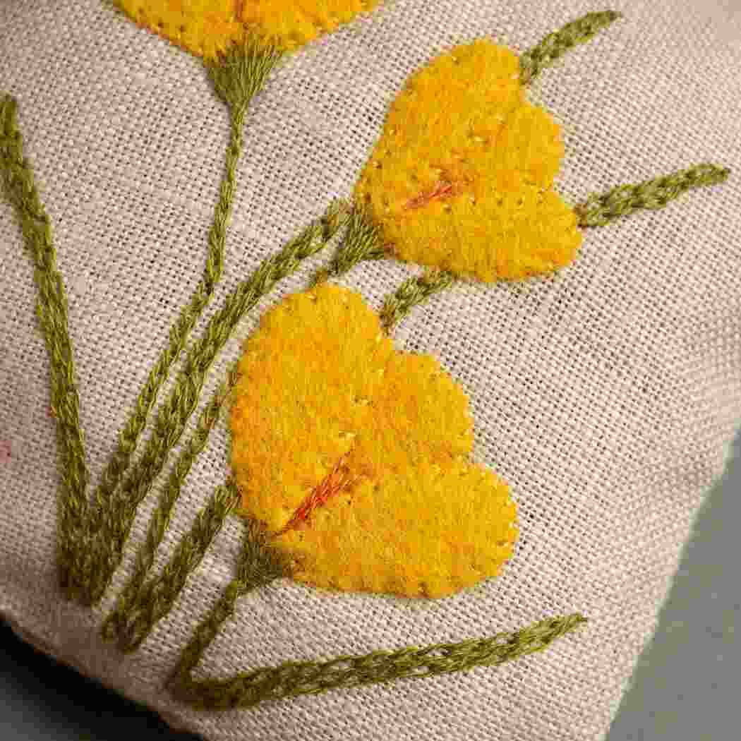 up close of yellow flowers with green stem.