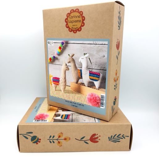 cardboard box with picture of felt llamas with colourful detail and corinne Lapierre branding.