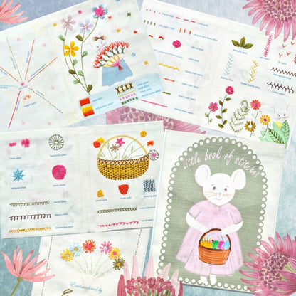 items from kit spread out on a table with floral illustrations along the edges.
