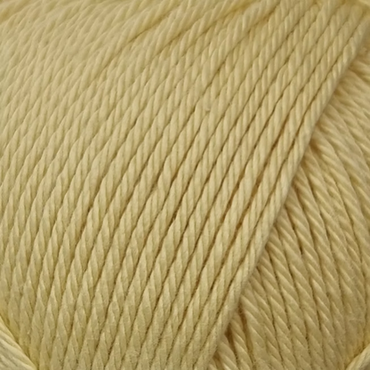 close up of light yellow cotton yarn ball.