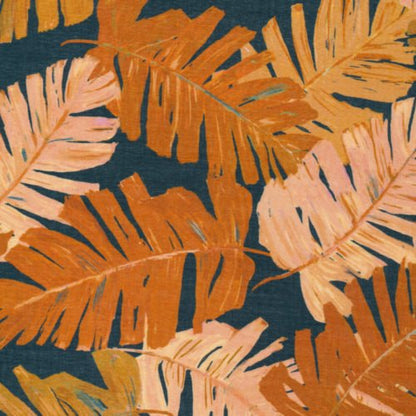 Del Mar design from Sunday Collection for Cloud9 Fabrics, a pattern of palm leaves in orange and pink on a dark blue background.