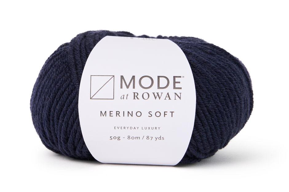 dark blue ball of yarn with mode at rowan label with grey writing  on a plain white background.