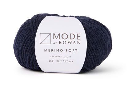 dark blue ball of yarn with mode at rowan label with grey writing  on a plain white background.