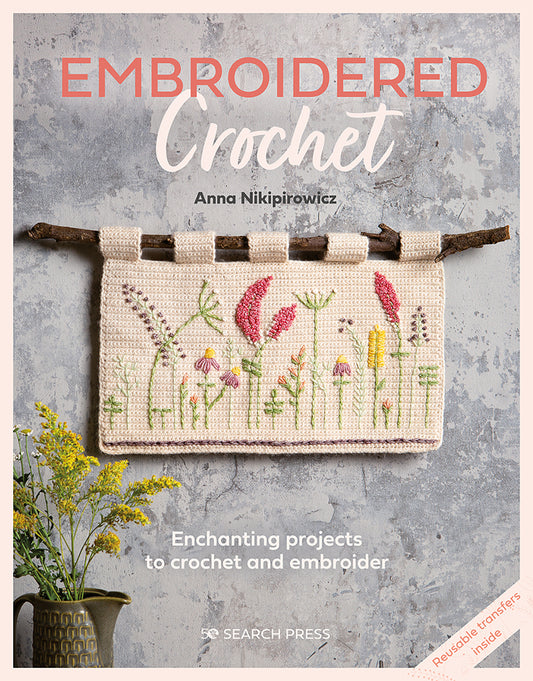 book cover of 'embroidered crochet, by Nikipirowiez, enchanting projects to crochet and embroider. with an image of a embroidered crochet tapestry hung from a branch and search press logo at the bottom.