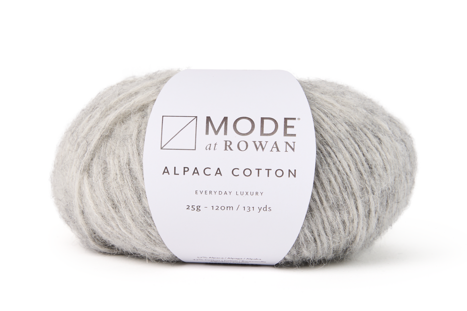 light grey ball of yarn with white mode at rowan label that has grey writing. on a white background.