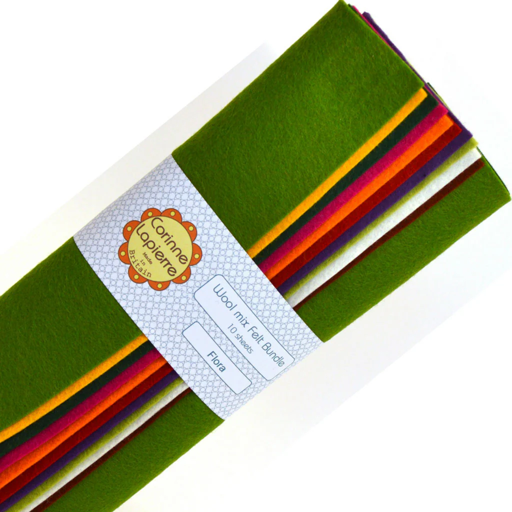 bundle of colourful felt with corinne branded label around them.