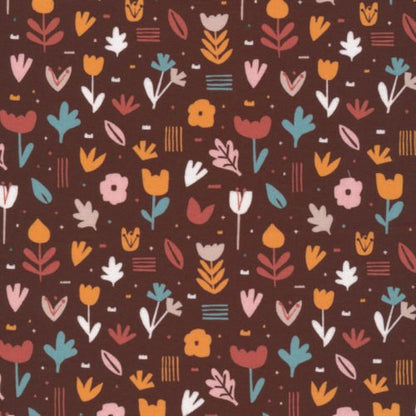 A swatch of Flower Bed Brick from Jungle Dreams Collection for Cloud9 Fabrics, a stylised flower design in blue, yellow, white and peach on a dark brown background.
