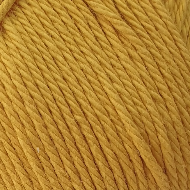 close up of golden yellow cotton yarn.