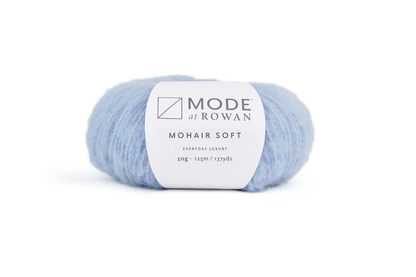 Blue ball of yarn with mode at rowan label on a plain white background.