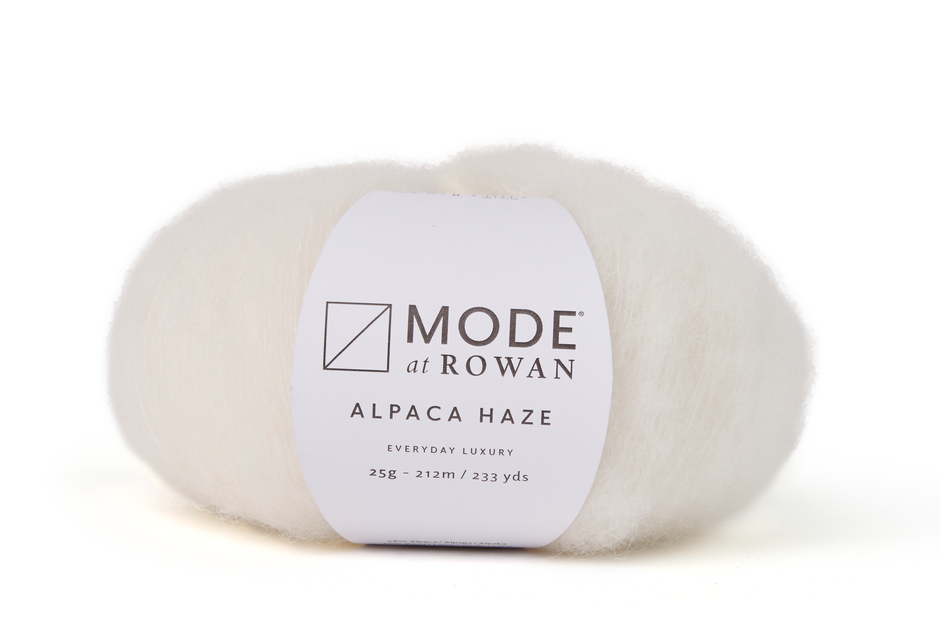 ball of white fluffy yarn on white background with mode at rowan label with grey writing.