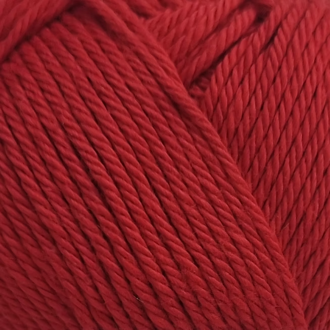 close up of deep red cotton yarn ball.