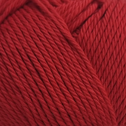close up of deep red cotton yarn ball.