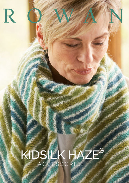 Woman wearing a striped scarf with 'Rowan Kidsilk Haze' branding.
