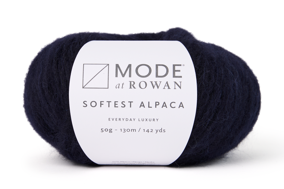 ball of navy blue yarn with a mode at rowan label on a white background.
