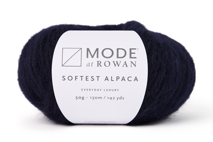 ball of navy blue yarn with a mode at rowan label on a white background.