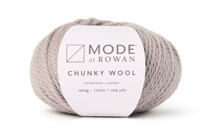 ball of grey yarn with mode at rowan label on a plain white background.