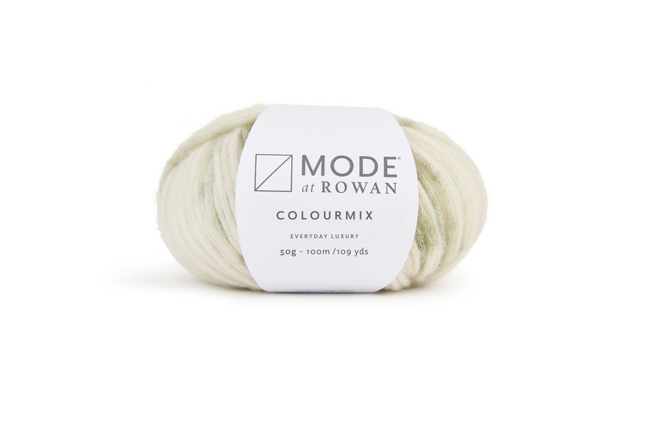 Ball of cream and green yarn with mode at rowan label on a plain white background.