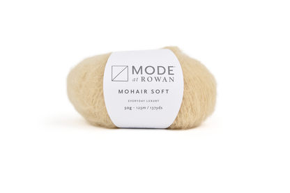 ball of neutral coloured yarn with mode at rowan label on a plain white background.