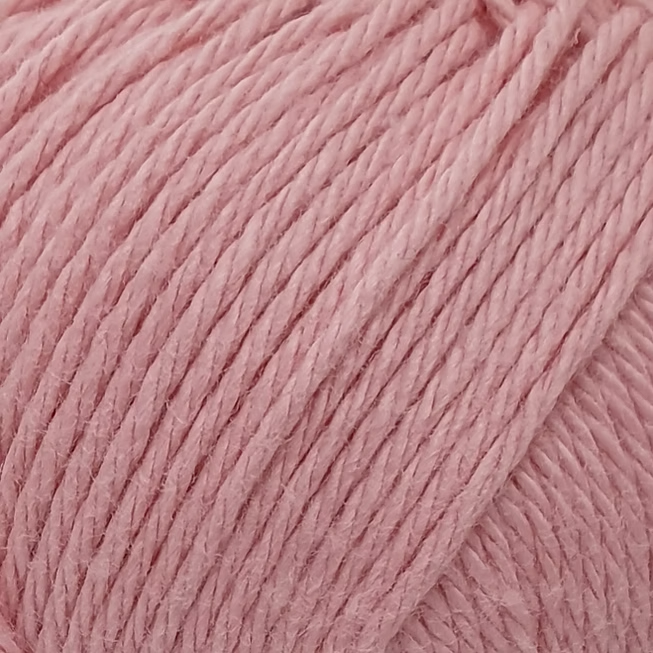 close up of light peach coloured cotton yarn.