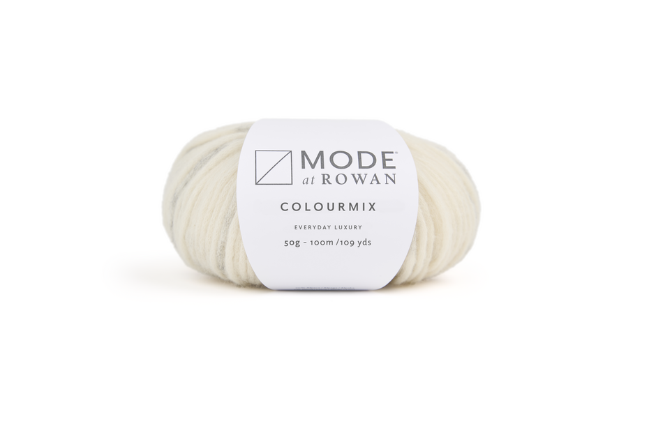 Ball of cream and grey yarn with mode at rowan label on a plain white background. 