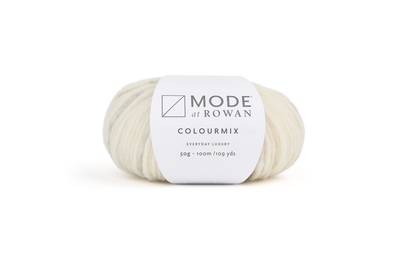 Ball of cream and grey yarn with mode at rowan label on a plain white background. 