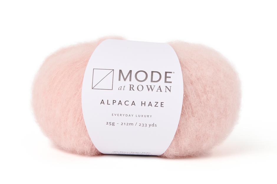 light pink ball of fluffy yarn on a plain white background with mode at rowan label with grey writing.