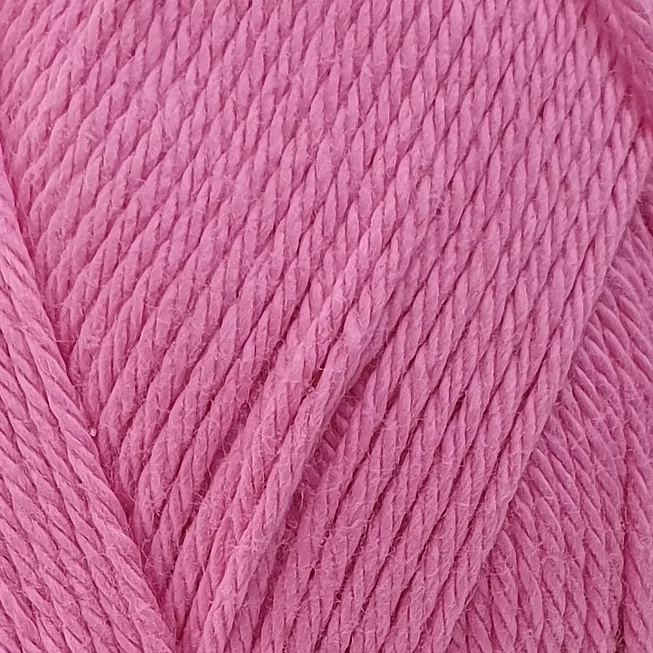 close up of deep pink coloured cotton yarn.