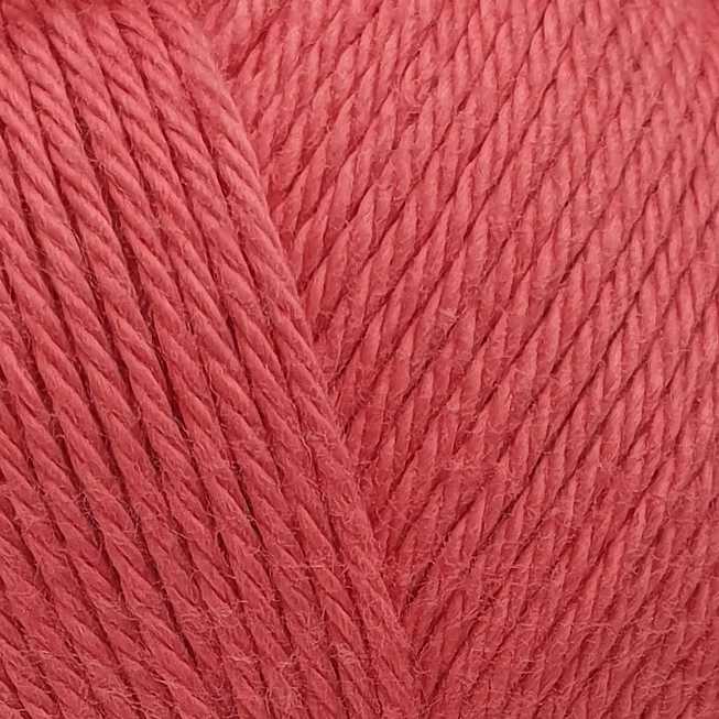 close up of bright pink cotton yarn ball.