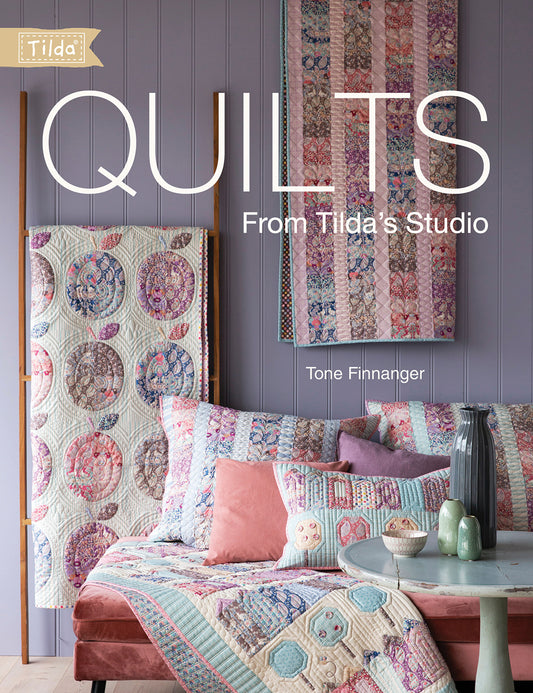 book cover of quilts from tilda studio  with Tilda logo with an image of an assortment of quilts. 