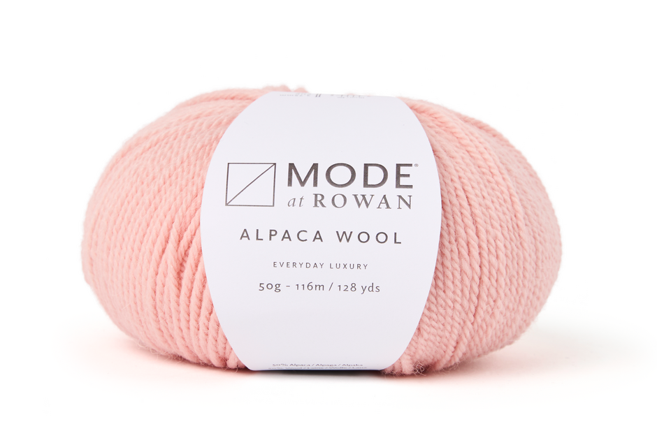 ball of light powder pink yarn with mode at rowan label on a white background.