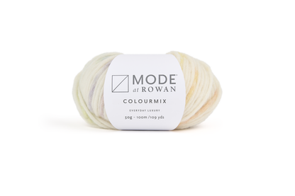 ball of cream and multicoloured yarn with mode at rowan label around it on a plain white background.