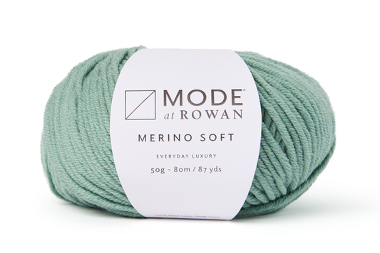 green ball of yarn with mode at rowan label on a plain white background.