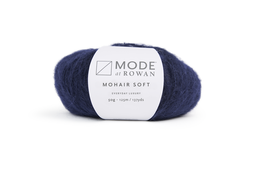 dark blue ball of yarn with white mode at rowan label and grey writing