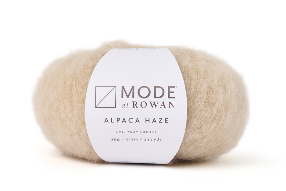 ball of fluffy off white with white background and mode at rowan label with grey writing. 