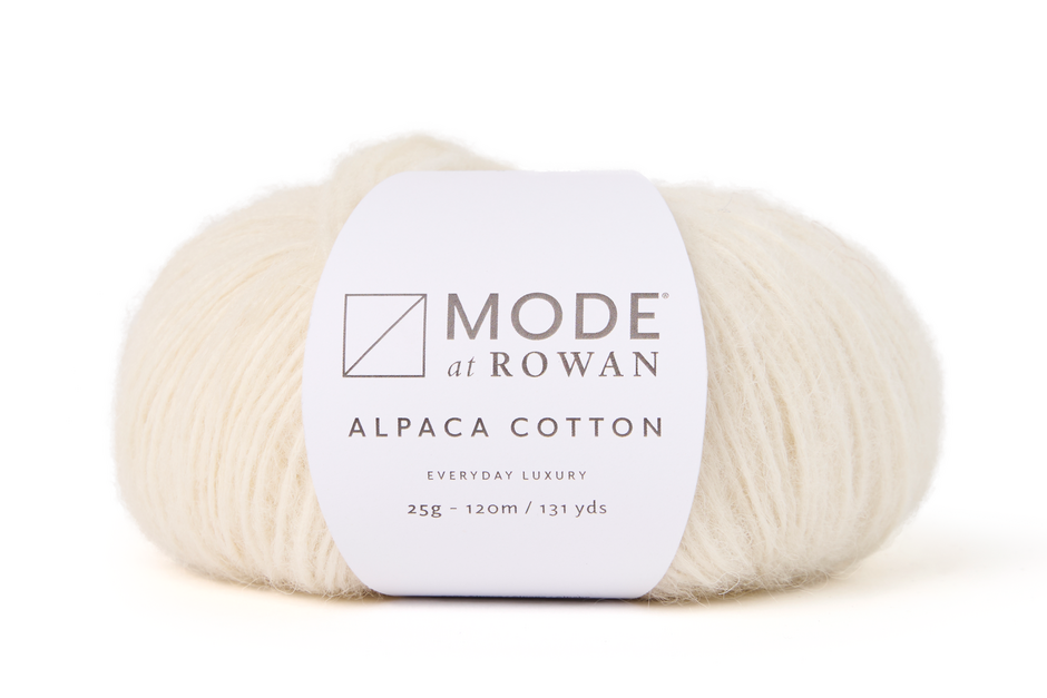 cream ball of yarn with mode at rowan label and grey writing on a plain white background.