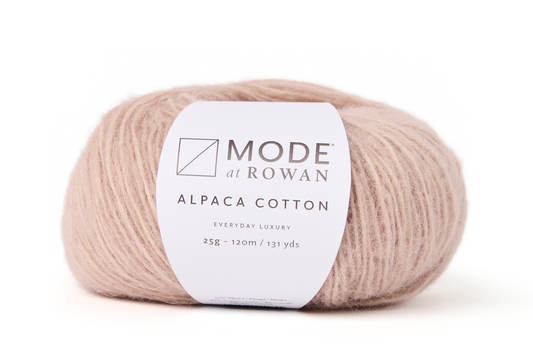 Off white ball of yarn with mode at rowan label that has grey writing and plain white background.