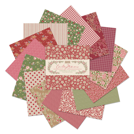 Creating Memories fabric charm pack of 5" x 5" squares by Tilda  with a red and green theme of small prints, checks and stripes, photographed against a white background.