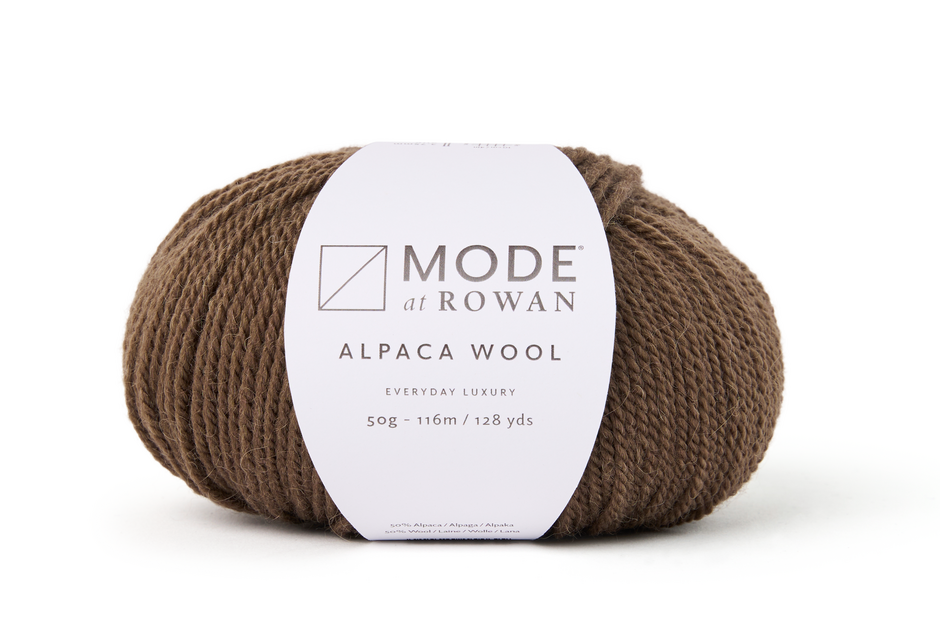 walnut brown ball of yarn with mode at rowan label on a white background. 