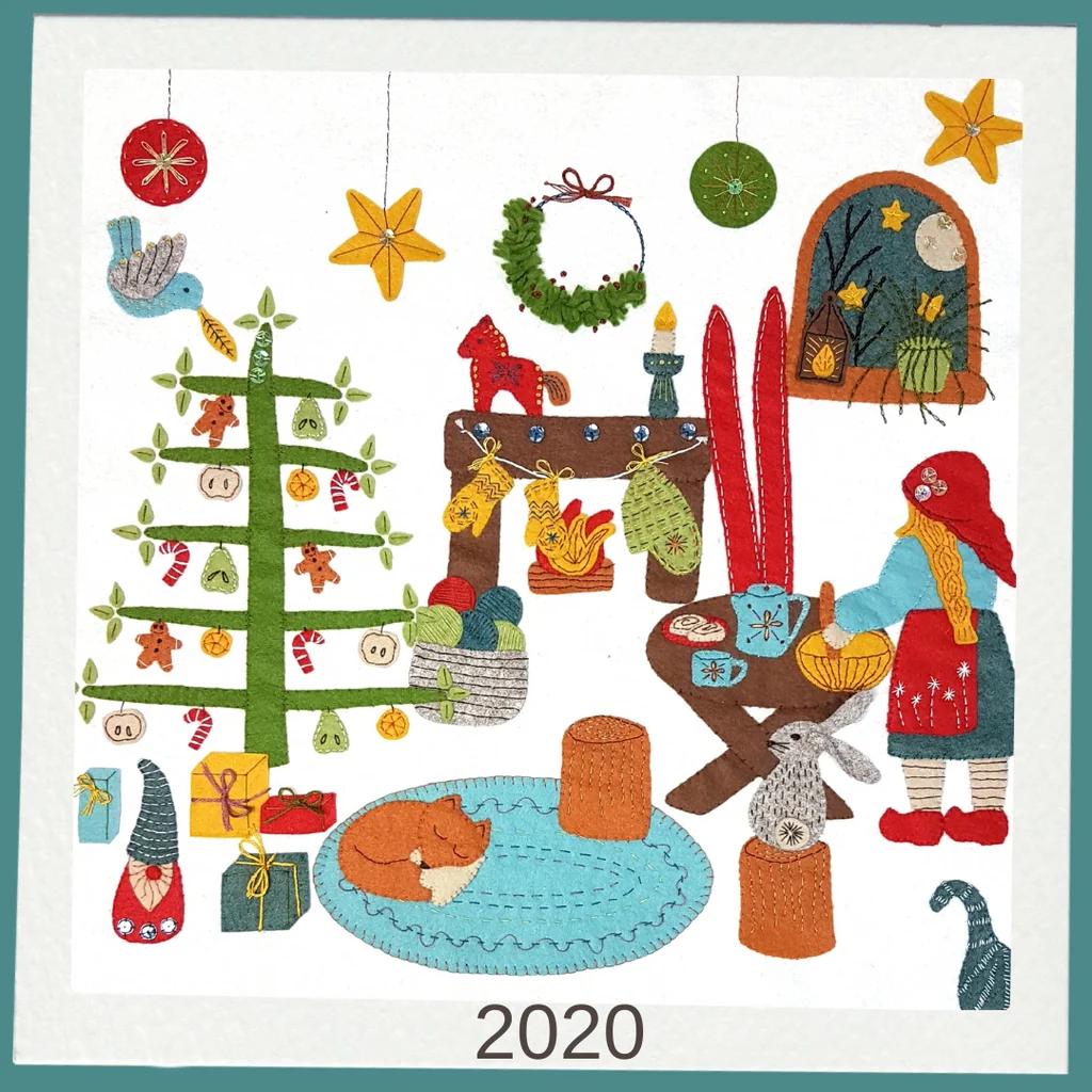 stitched felt scene with a Christmas tree, ornaments, and people in festive attire, featuring the year 2020.