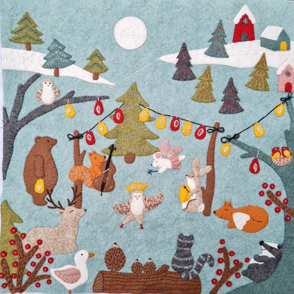stitched felt scene of forest animals in a winter scene with trees, lights, and a moon.