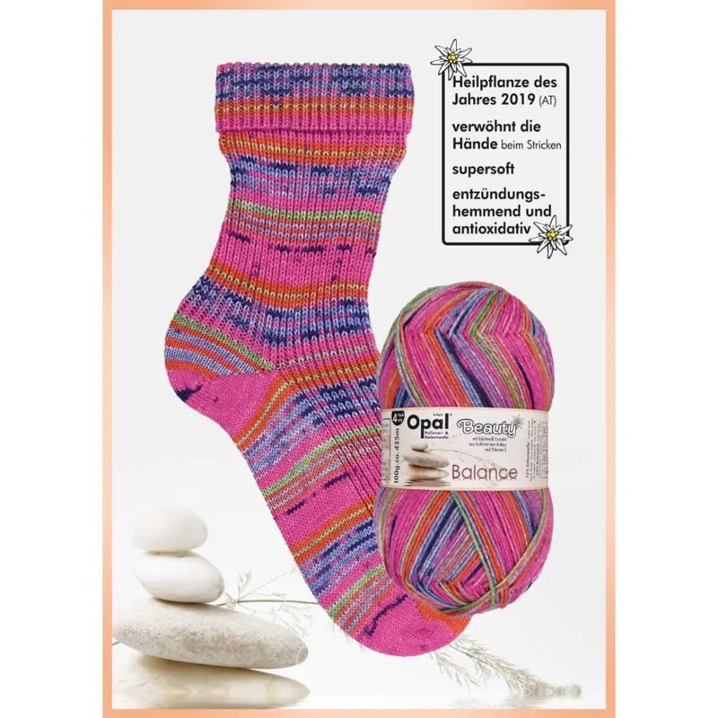 Colourful striped sock and ball of yarn with pink, blue green and orange with  Opal brand label on a white background.