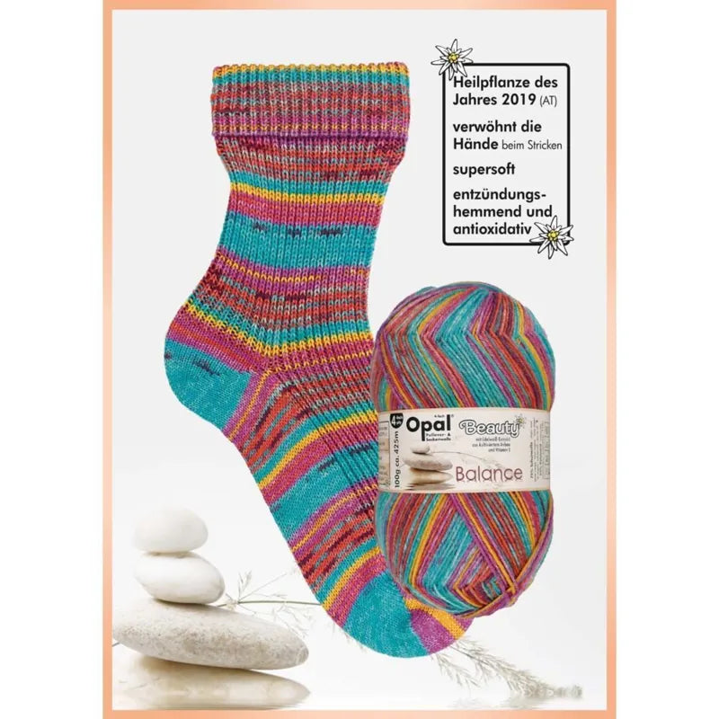 Colourful striped sock and ball of yarn with blue pink orange and yellow with Opal brand label on a white background. 