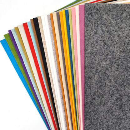 collection of coloured wool mix felt displayed on a white surface.  