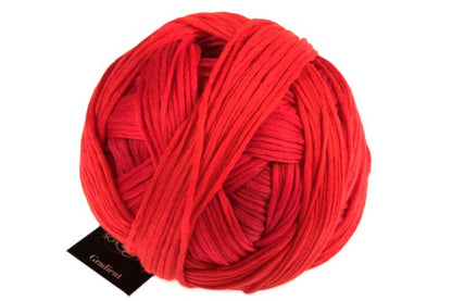 Image shows wound ball of Schoppel Gradient DK yarn. Colourway is 2435 Furnace/Hochofen shades  of bright  red and orange.