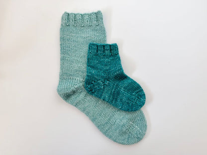image of large and small sock layed on one and other.