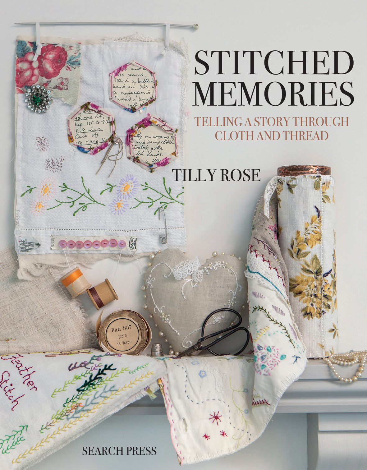 Book cover of 'Stitched Memories' by Tilly Rose with embroidered fabric and sewing items. with search press branding at the bottom.